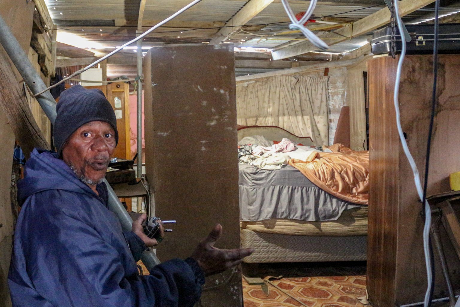 Wrongly demarcated land leaves family without an RDP house Angry Makhanda resident Vuyani Bashe in his shack in upper Mnandi. He and his family have been deprived of an RDP house because of inaccurate town planning. Photo: Luvuyo Mjekula